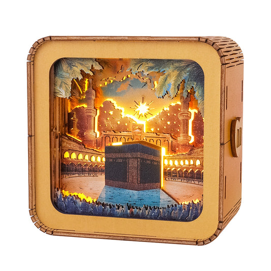 3D wooden puzzle night light featuring the Kaaba in Makkah with illuminated details and a scenic background.