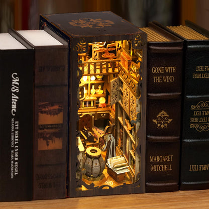 Illuminated DIY book nook kit showcasing detailed music-themed decor inside a wooden puzzle design.