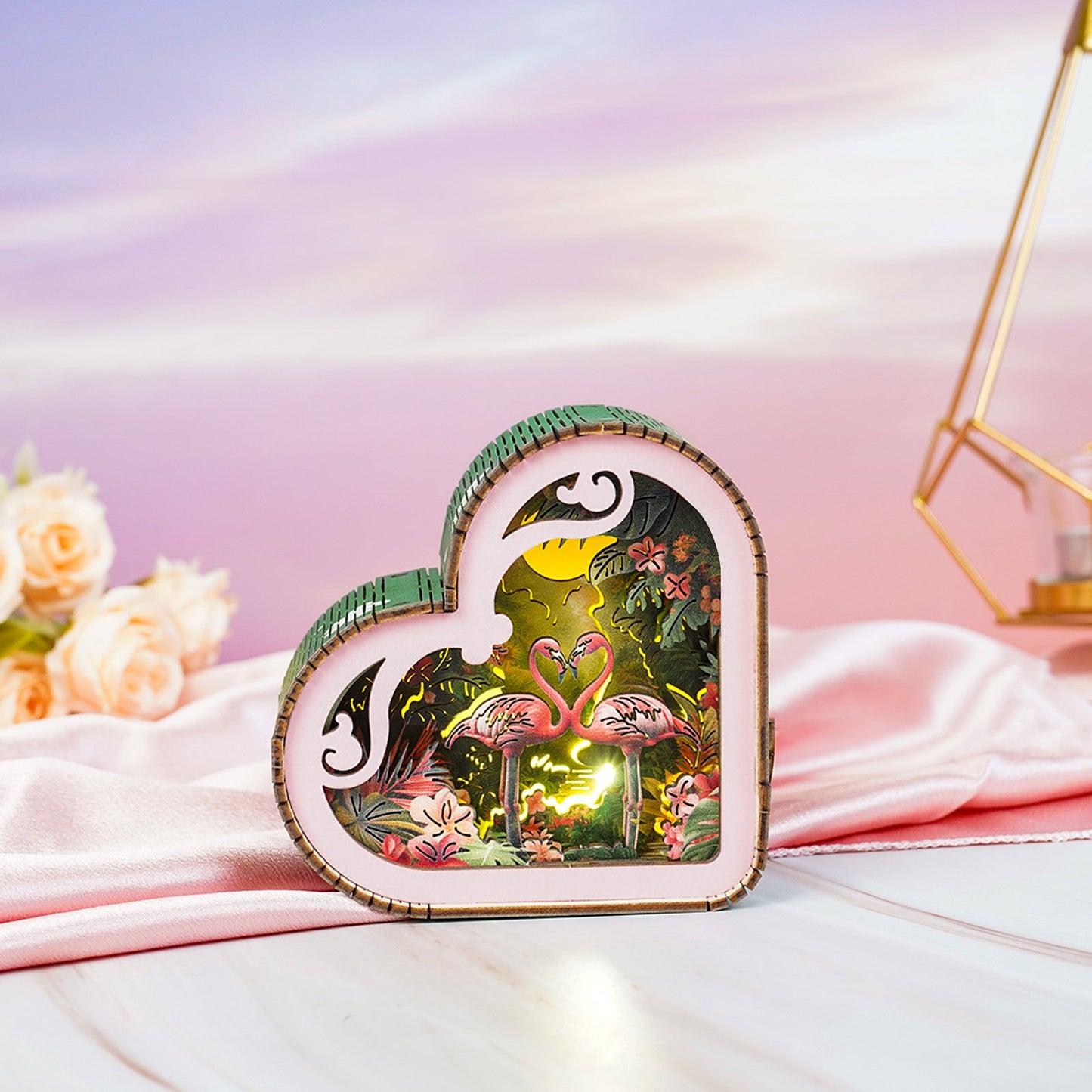 Flamingo with moonlight forest design 3D wooden puzzle night light, heart-shaped and vibrant, set against soft pastel background.