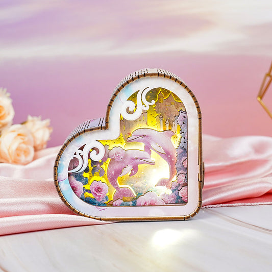 Dolphins and Fantasy Ocean Kit 3D wooden puzzle night light in a heart shape with colorful ocean scene.