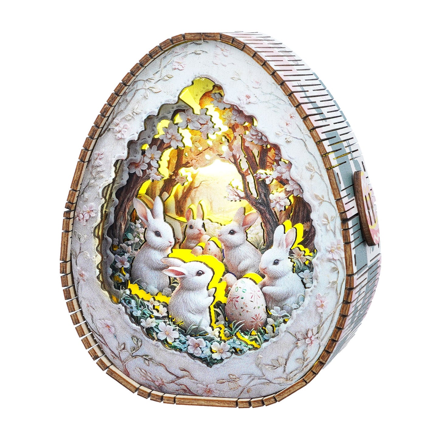 Easter egg wooden puzzle night light featuring rabbits in a floral scene, glowing softly in a whimsical design.