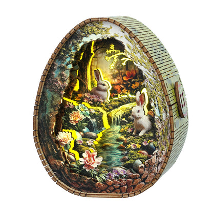 3D wooden puzzle night light featuring a rabbit scene by a stream with flowers and soft glowing lights.