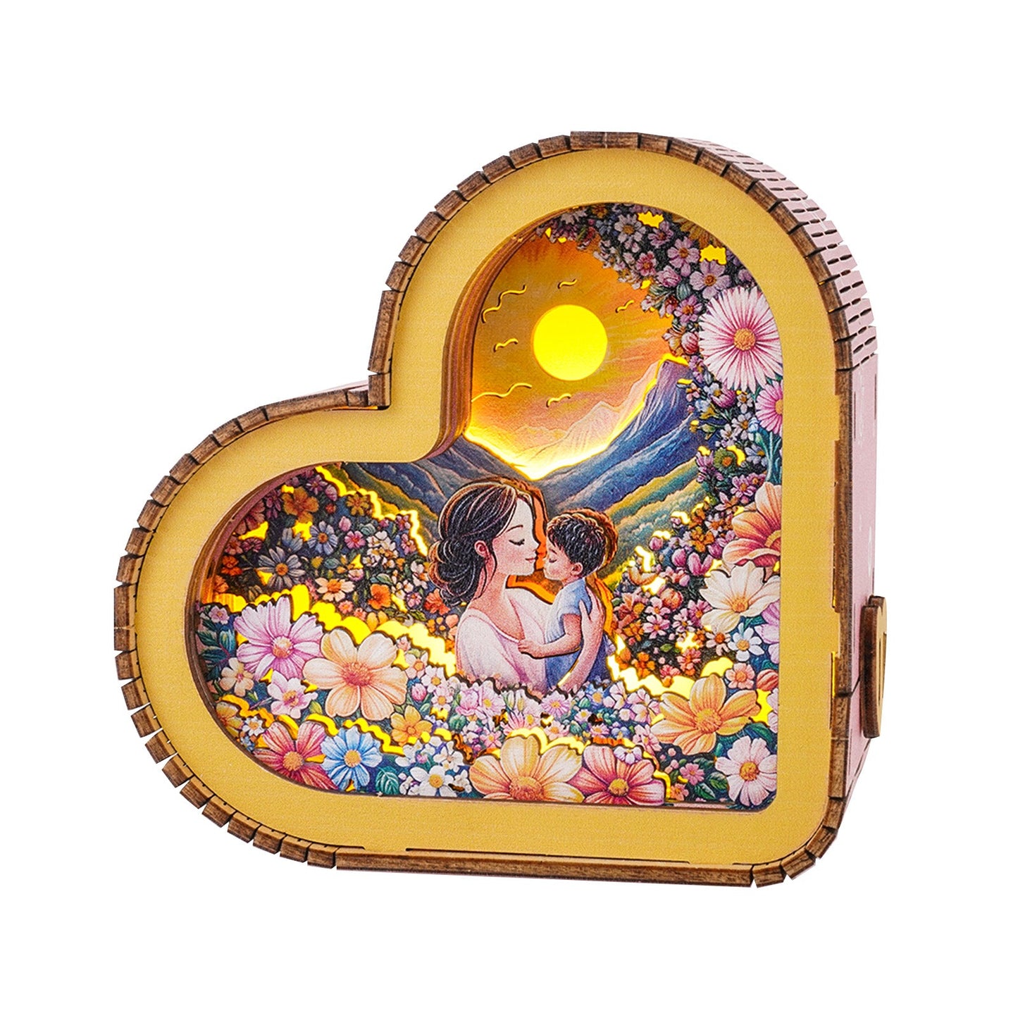 Heart-shaped night light showcasing a mother and child in a floral landscape, radiating warmth and love.