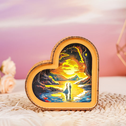 Heart-shaped 3D wooden puzzle night light featuring a couple by a scenic river at sunset.