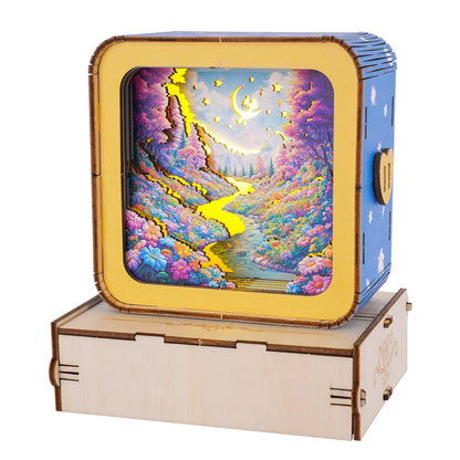 Dream Forest Kit 3D wooden puzzle night light showcasing a colorful nature scene with a river and stars.