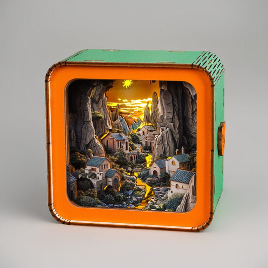 Valley Village Kit 3D wooden puzzle night light showcasing a serene illuminated landscape with houses and mountains.