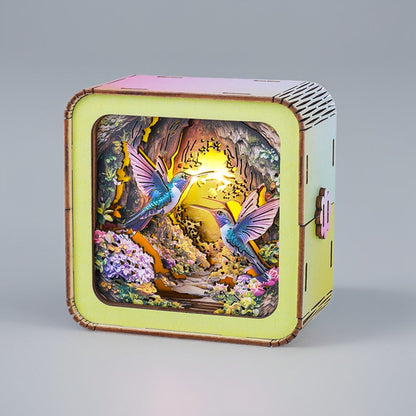 3D wooden puzzle night light featuring colorful hummingbirds and a vibrant natural scene.