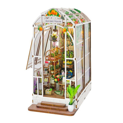 DIY Garden House book nook kit featuring detailed wooden puzzle with plants and musical elements.