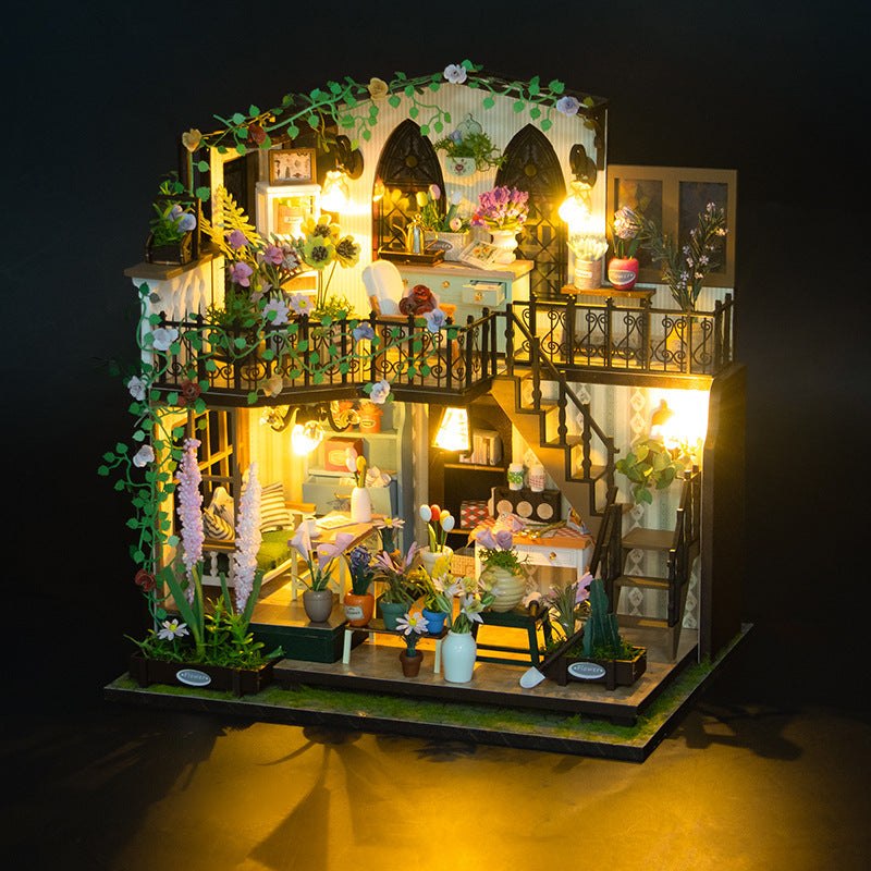 Daisy's Flower Room DIY Dollhouse Kit illuminated with colorful flowers and intricate furniture, showcasing a charming miniature interior.