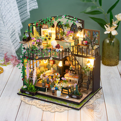 Daisy's Flower Room DIY dollhouse kit, 3D wooden puzzle with intricate details and warm lighting.