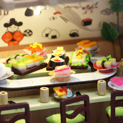 Colorful miniature sushi display in a DIY dollhouse kit, showcasing vibrant delicacies like nigiri and maki.