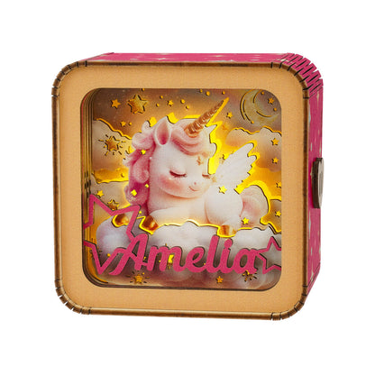 Personalized 3D wooden puzzle night light featuring a unicorn with the name Amelia, glowing softly against a starry background.